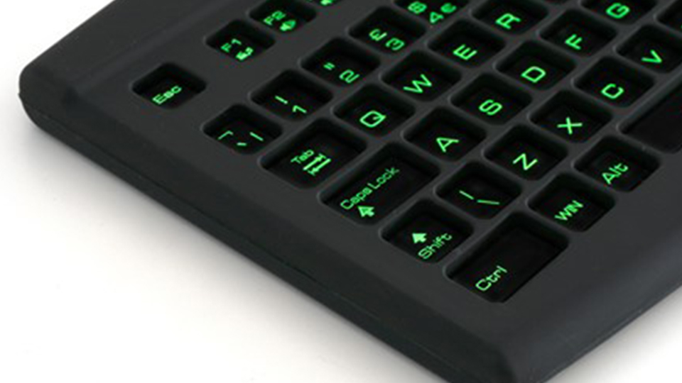 A close-up of the keyboard. The keys are lit green.
